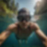 Diving Into Clear Waters with Proper Gear Swimmer wearing goggles and cap diving into clear water