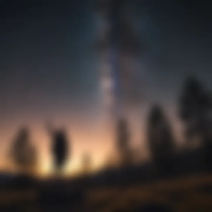 Silhouetted person pointing towards the starry sky