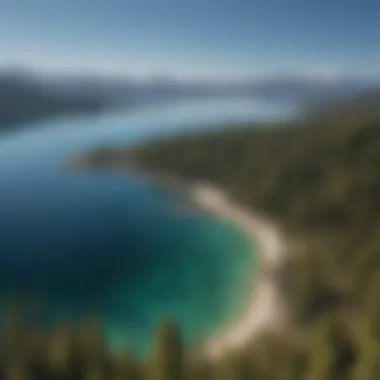 Aerial view of the crystal-clear waters of Lake Tahoe surrounded by mountains