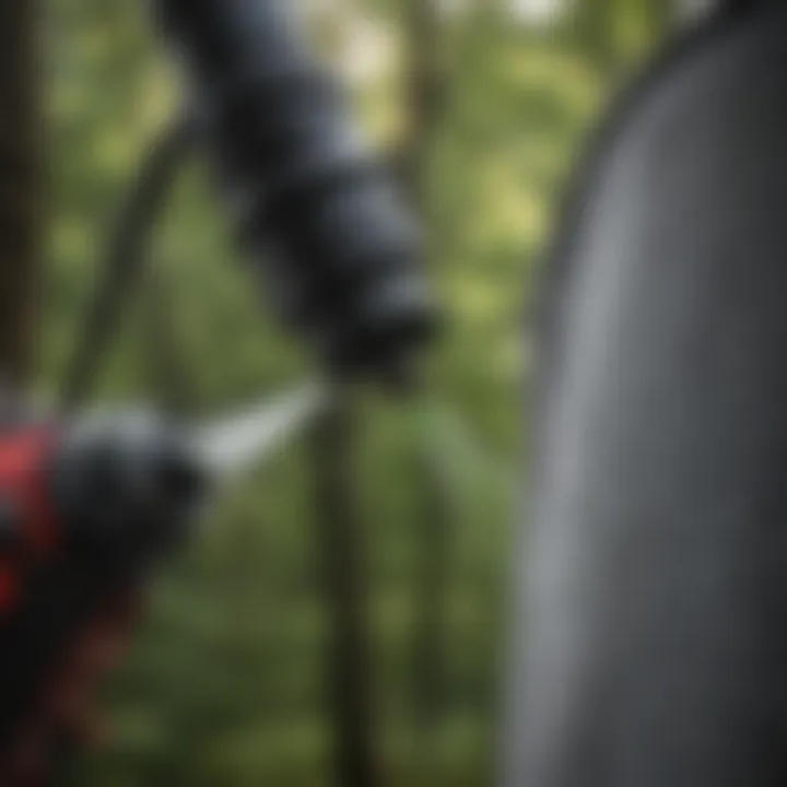 A close-up view of a nozzle being attached to a sprayer