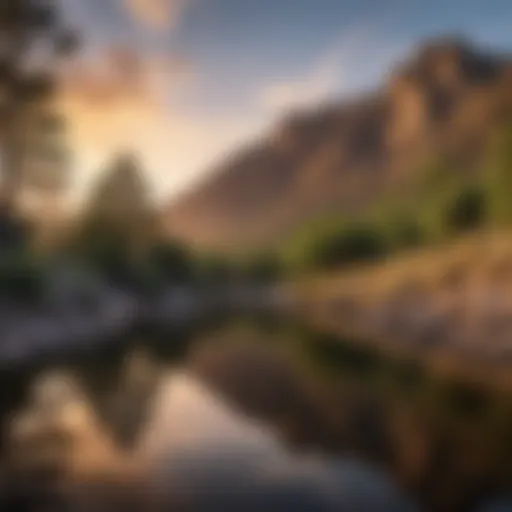 A serene view of Sandia Peak reflecting in a tranquil lake at sunset